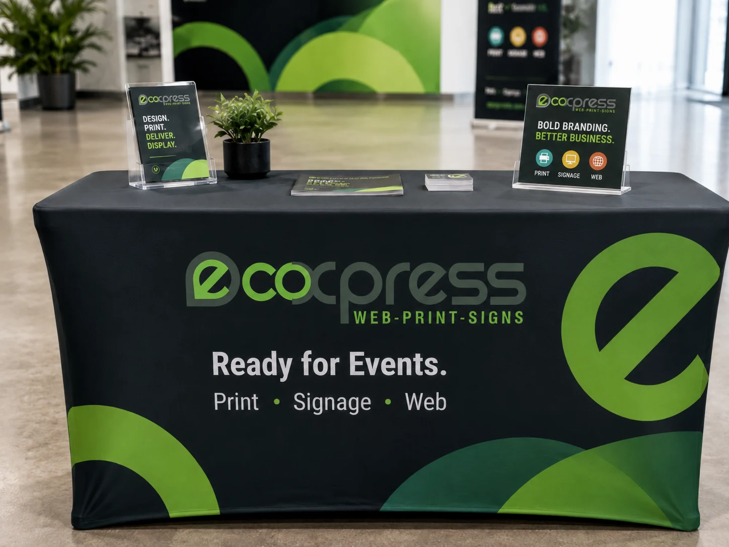 EcoExpress branded table cloth with matching fabric display signage