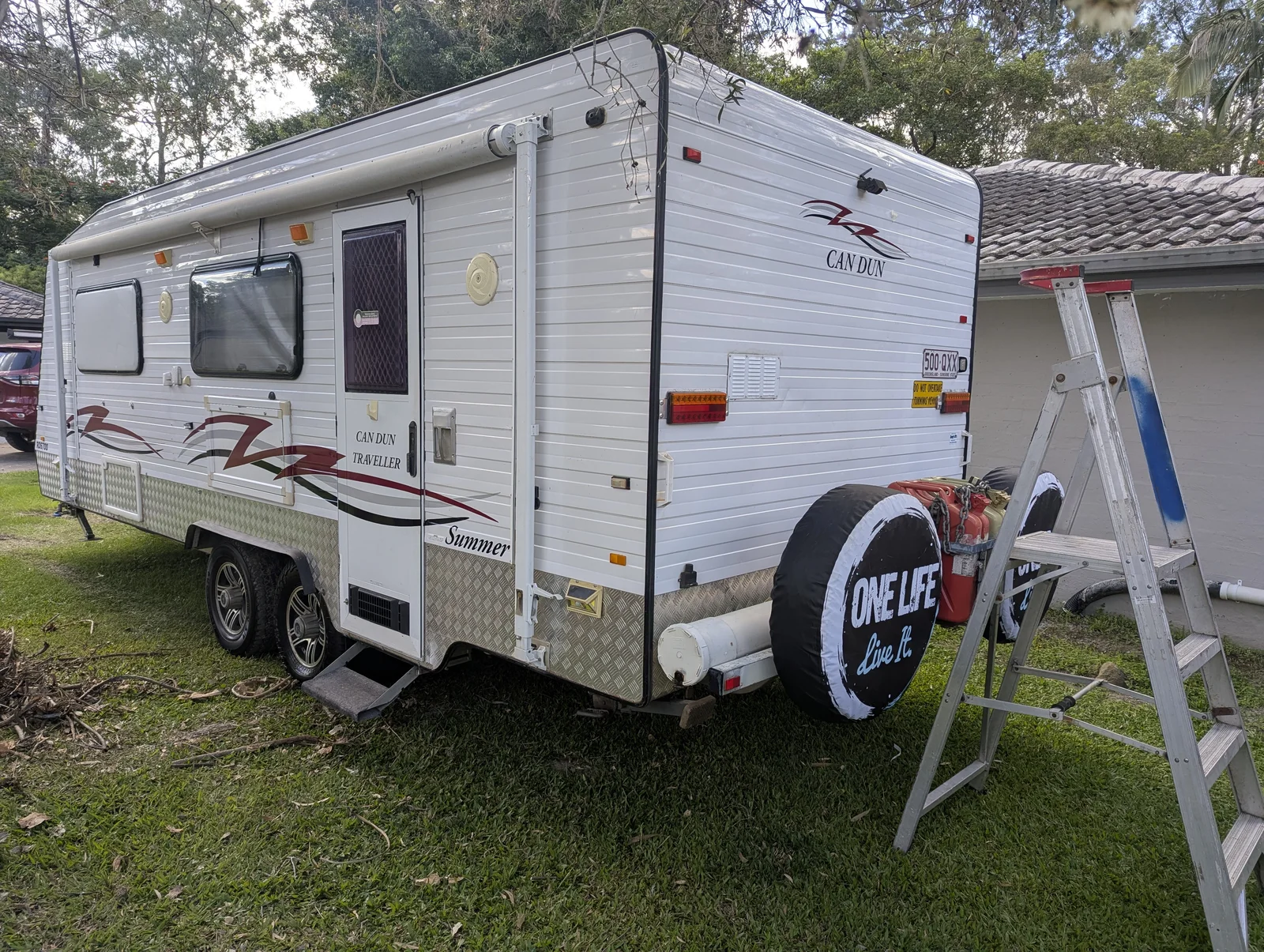 CANDUN caravan with refreshed side decals after EcoExpress vinyl decal work