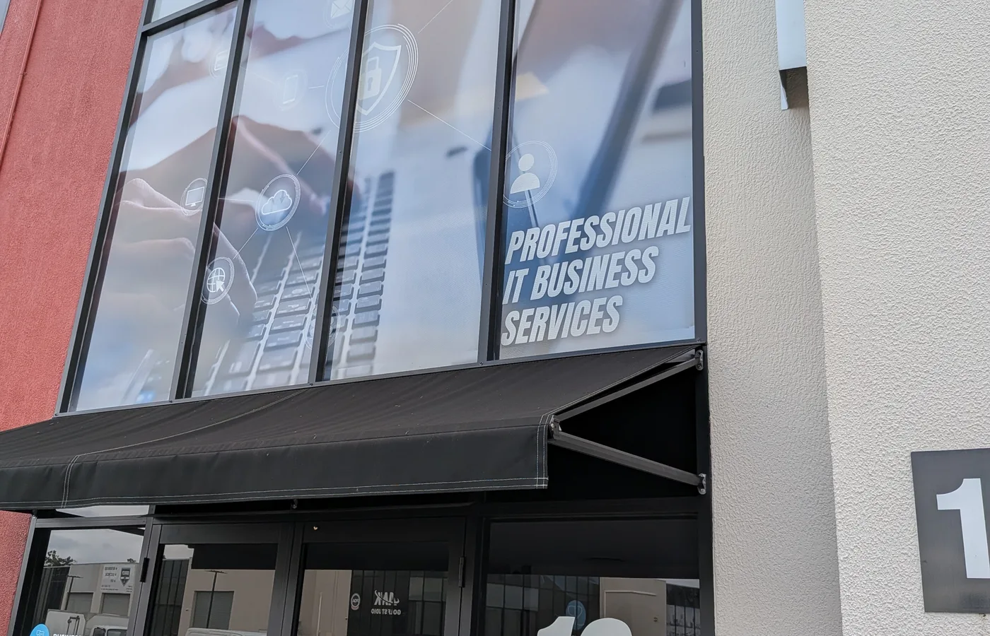 Shopfront signage and window graphics installed for a local business